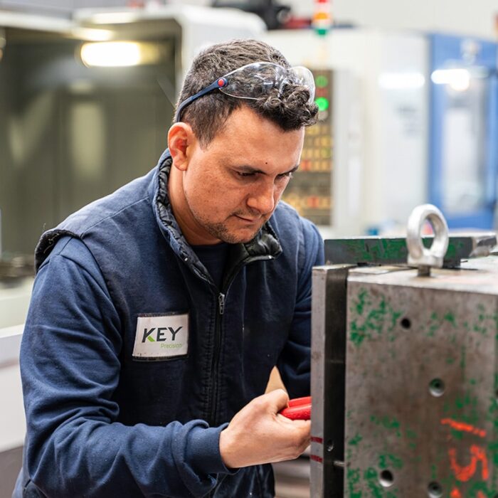 Key Precision lathe worker measuring metal mould